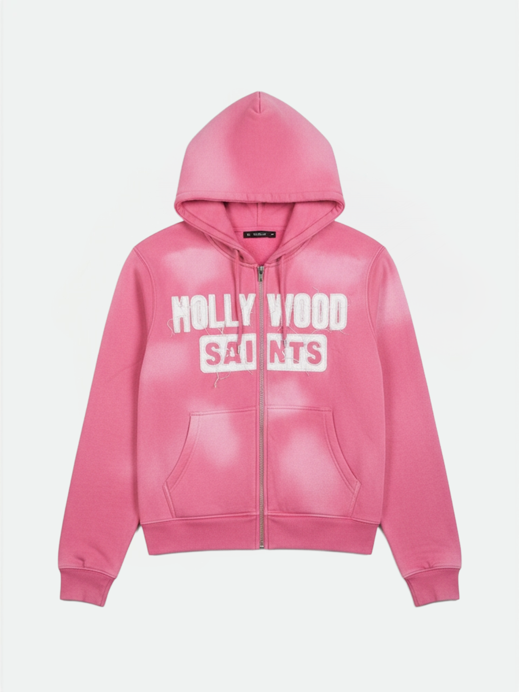 Hollywood Saints frost pink sun fade zip hoodie featuring bold white varsity text, front angle.