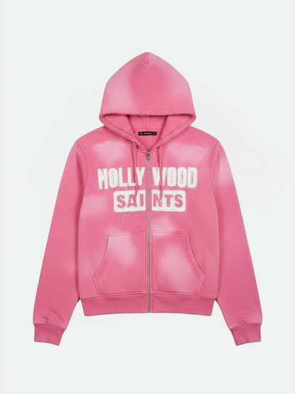 Hollywood Saints frost pink sun fade zip hoodie featuring bold white varsity text, front angle.